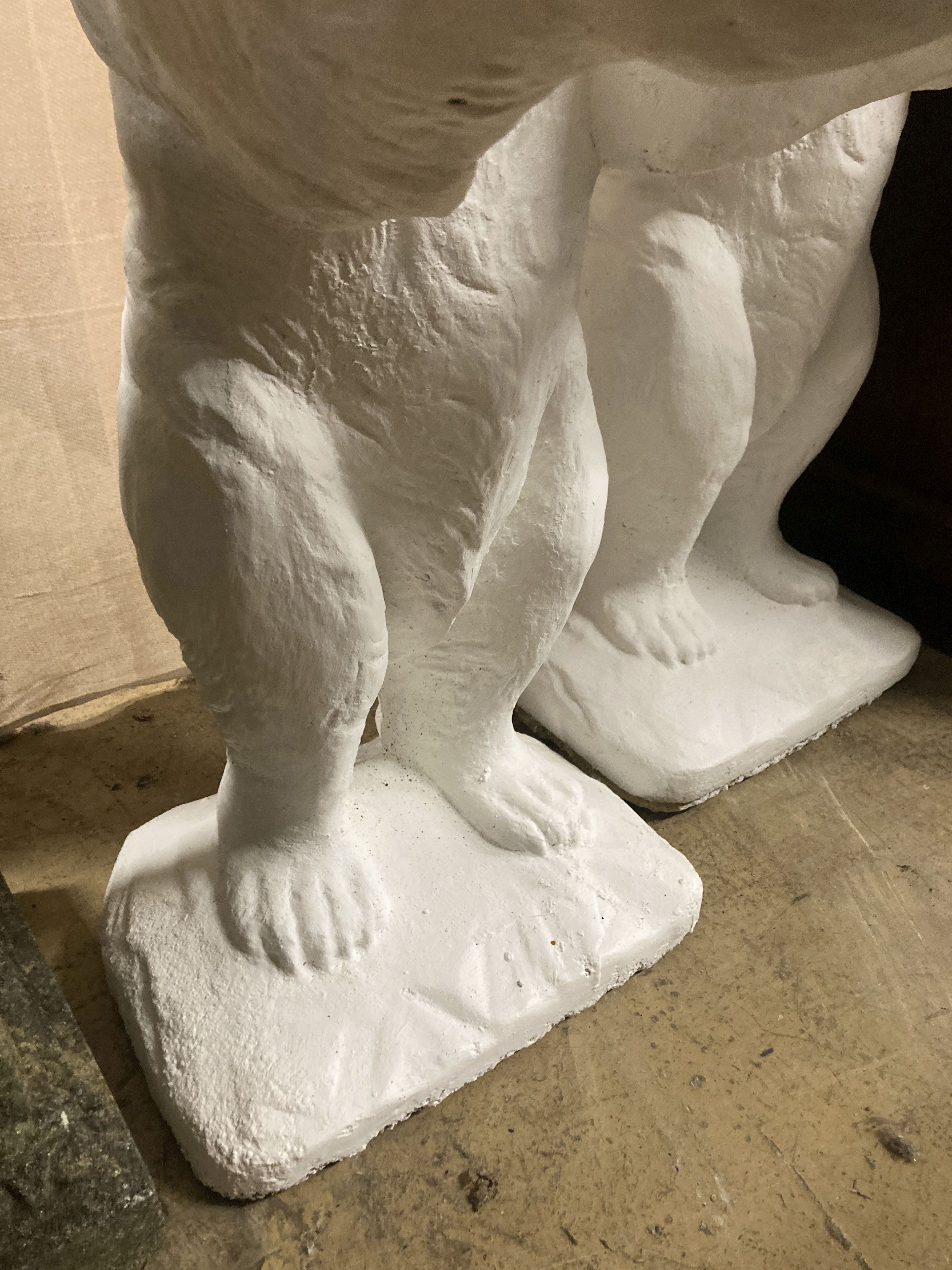 A pair of painted bear reconstituted stone garden pot holders, 97cm high